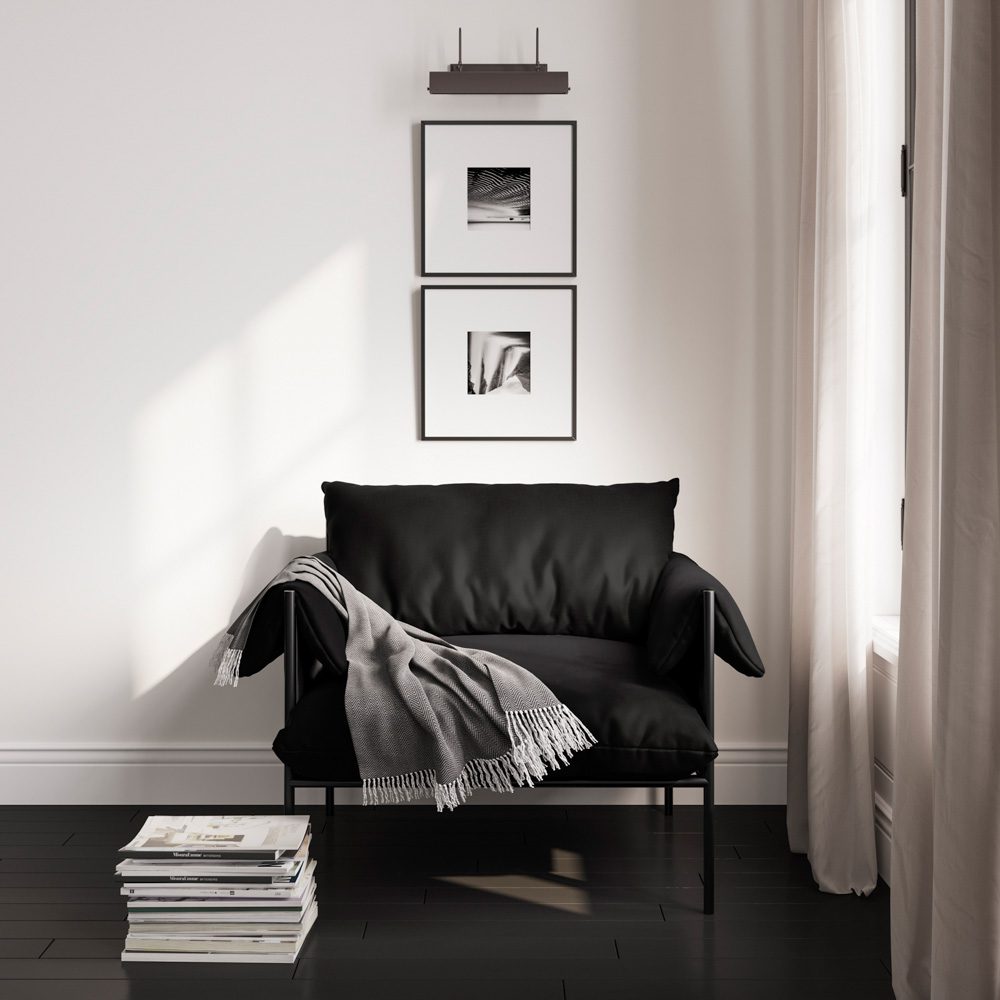 black armchair in a monochrome room